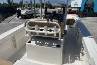 Slide: The Image of 2022 Trophy T20 boat interior with rod holders and seating in a marina setting. - 7