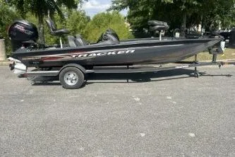 Slide: The Image of 2019 Tracker Pro Team 190 TX boat on trailer, parked outdoors. - 3