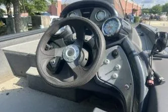 Slide: The Image of 2019 Tracker Pro Team 190 TX boat dashboard with steering wheel and gauges. - 9