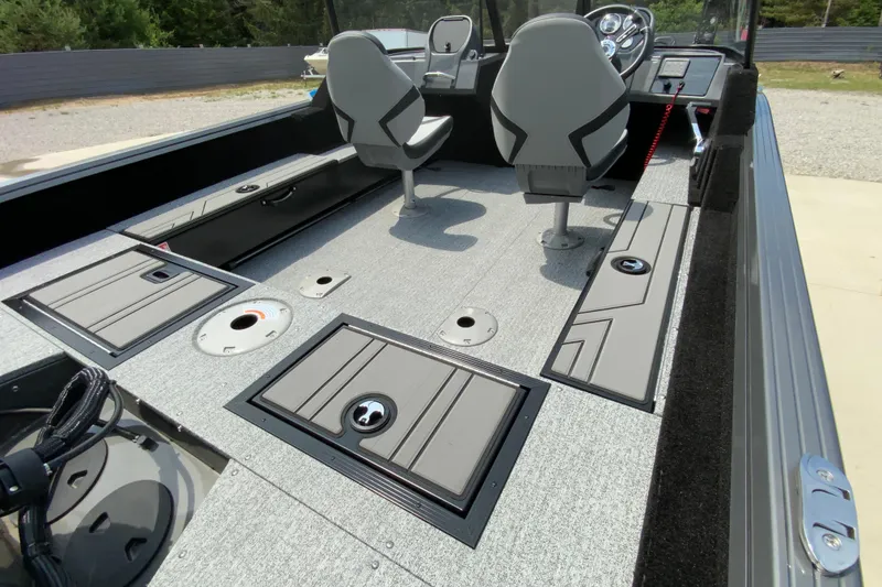 Slide: The Image of 2026 Starcraft Storm 166 DC boat interior with modern seating and storage compartments. - 10