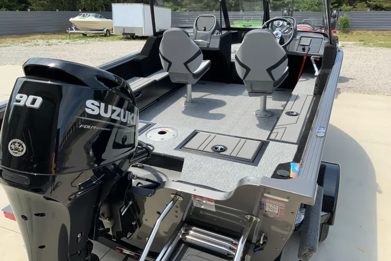 Slide: The Image of 2026 Starcraft Storm 166 DC boat with Suzuki 90 engine, featuring dual seats and modern design. - 2