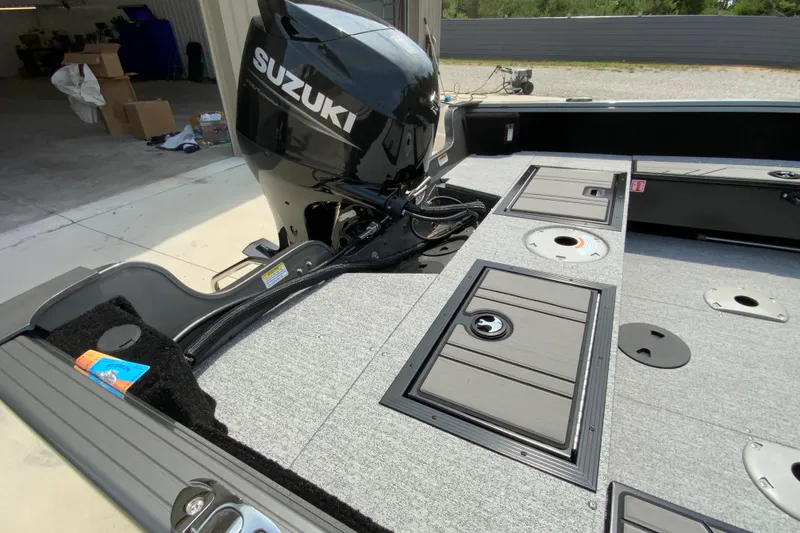 Slide: The Image of 2026 Starcraft Storm 166 DC boat with Suzuki outboard motor, featuring spacious deck layout. - 9