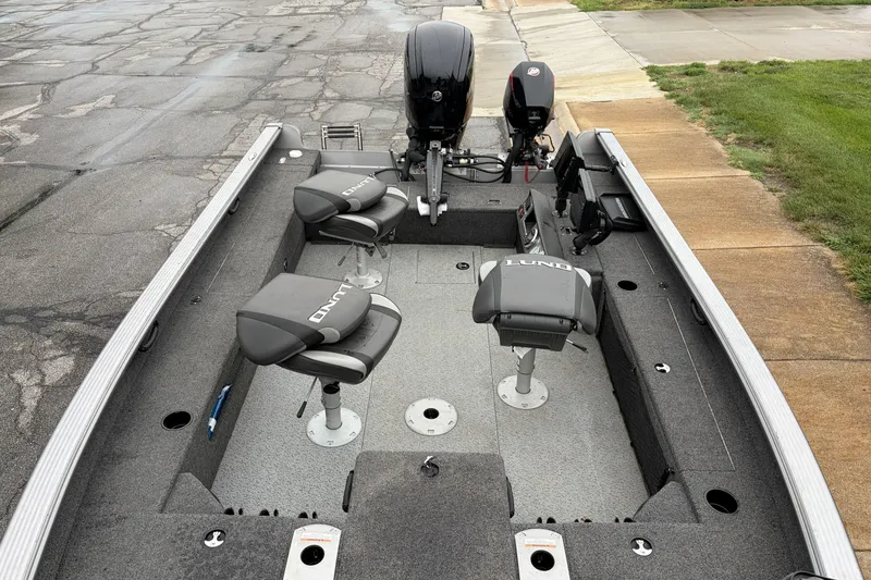 Slide: The Image of 2024 Lund 1875 Pro Guide fishing boat with swivel seats and dual motors. - 7