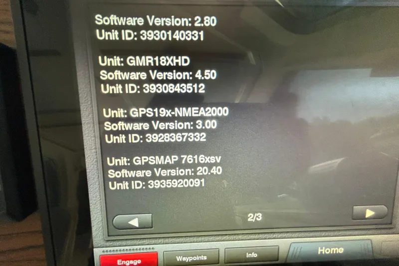 Slide: The Image of Display screen showing software versions and unit IDs for marine navigation systems on a 2016 Back Cove 34. - 45