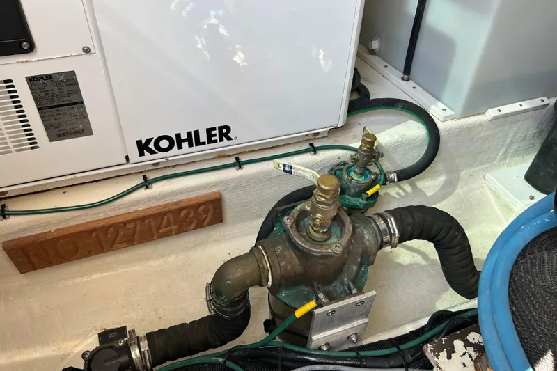 Slide: The Image of Engine room of 2016 Back Cove 34 with Kohler power system and plumbing components. - 30