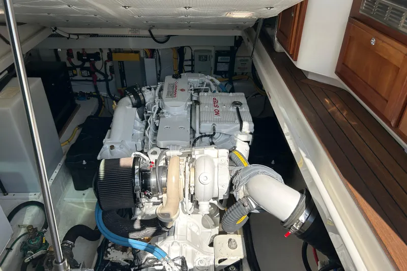 Slide: The Image of Engine compartment of a 2016 Back Cove 34 boat, featuring a Cummins engine. - 24