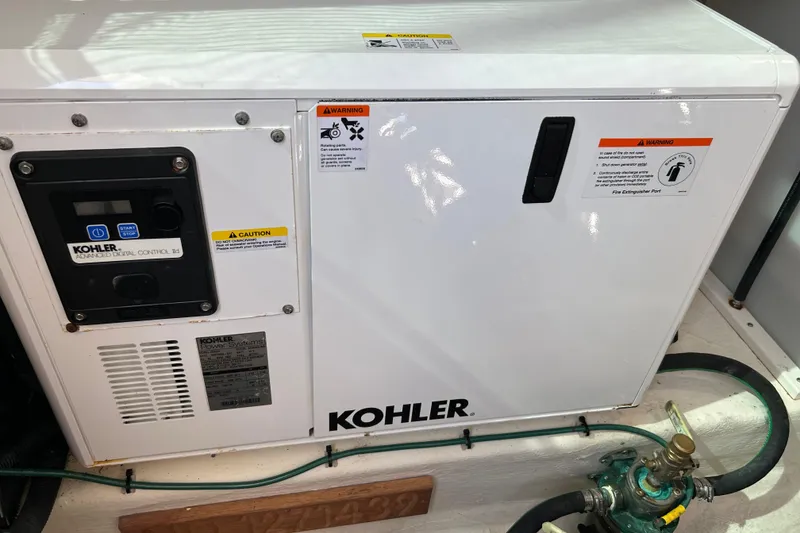 Slide: The Image of Kohler generator in 2016 Back Cove 34 boat, featuring advanced digital control panel. - 31