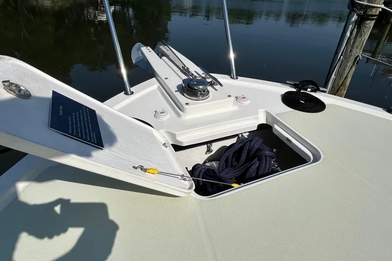 Slide: The Image of Bow of 2016 Back Cove 34 boat with open hatch and coiled rope. - 13