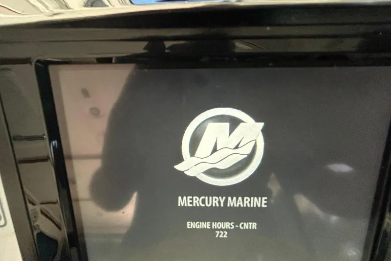 Slide: The Image of Display screen showing Mercury Marine logo and engine hours for Back Cove 34, 2016 model. - 46
