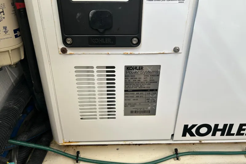 Slide: The Image of Kohler power system on 2016 Back Cove 34 boat, showing model and specifications. - 32