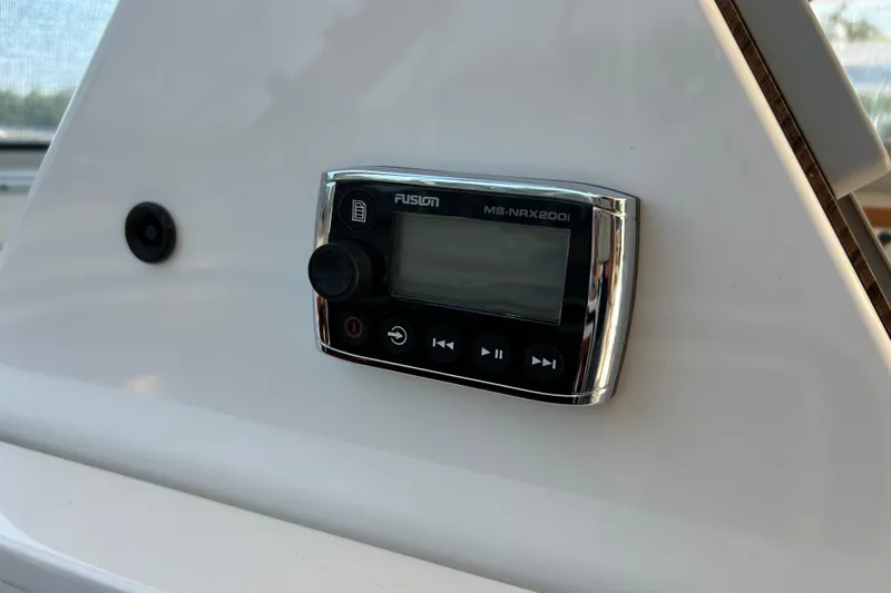Slide: The Image of Fusion MS-NRX200i stereo control on 2016 Back Cove 34 boat dashboard. - 41