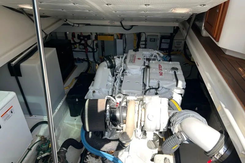 Slide: The Image of Engine compartment of a 2016 Back Cove 34 boat, featuring a Cummins engine. - 25