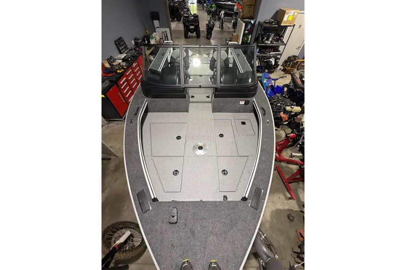 Slide: The Image of 2025 G3 Angler V1850 SF boat interior in a workshop setting. - 4
