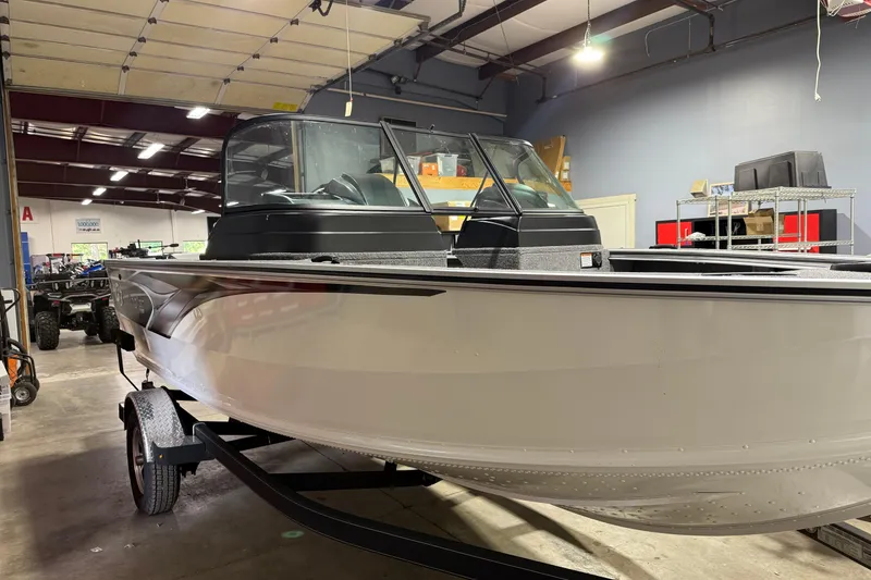 Slide: The Image of 2025 G3 Angler V1850 SF boat in a showroom, showcasing sleek design and modern features. - 1