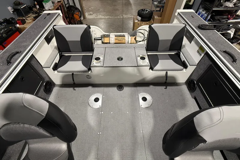 Slide: The Image of 2025 G3 Angler V1850 SF boat interior with gray seating and storage compartments. - 6