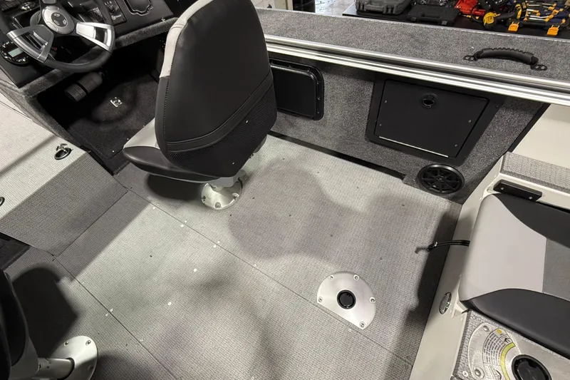 Slide: The Image of Interior of 2025 G3 Angler V1850 SF boat, featuring seating and storage compartments. - 12