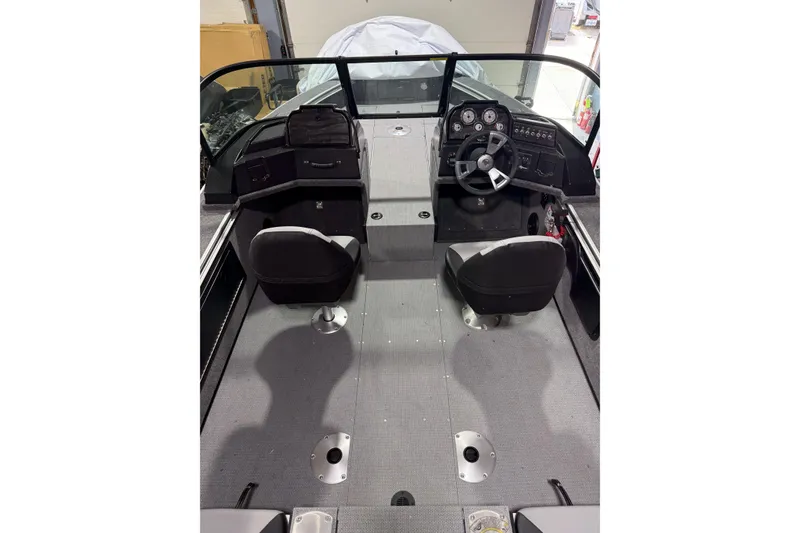 Slide: The Image of 2025 G3 Angler V1850 SF boat interior with dual seats and steering console. - 8
