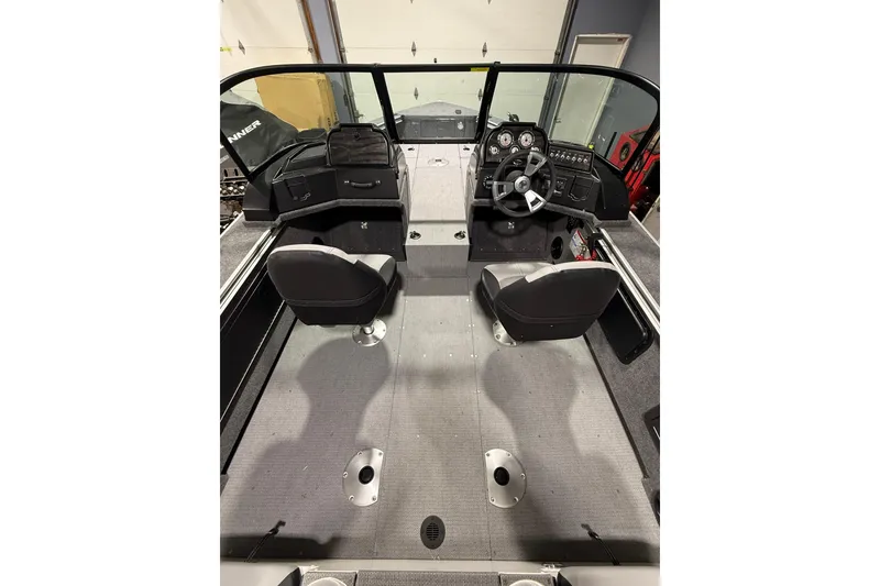 Slide: The Image of 2025 G3 Angler V1850 SF boat interior with dual seats and steering console. - 10