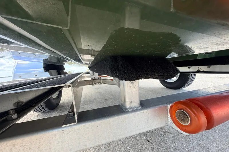 Slide: The Image of Underneath view of a 2025 Hell's Bay Professional boat on a trailer. - 20
