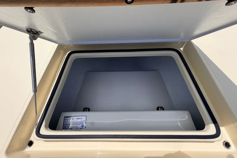 Slide: The Image of Open storage compartment of 2025 Hell's Bay Professional boat, showcasing interior space. - 34