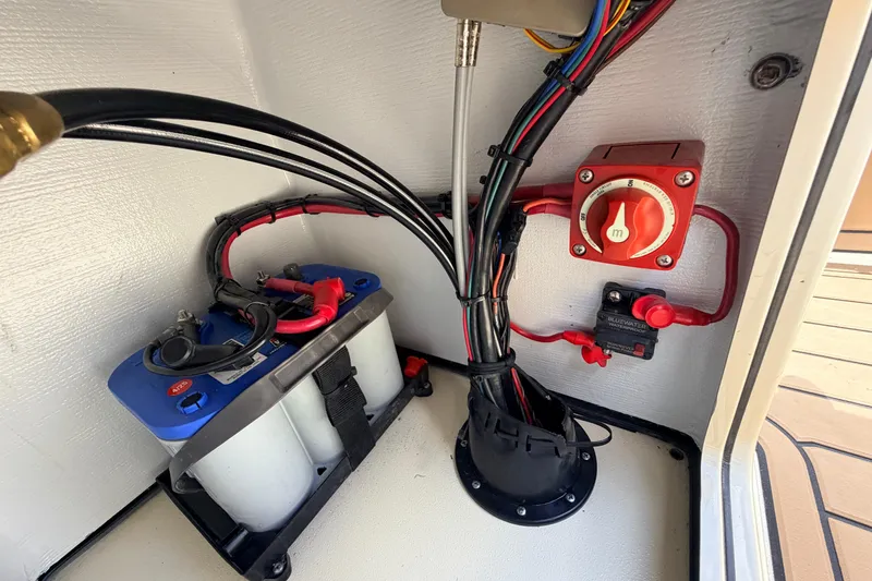 Slide: The Image of Electrical system of a 2025 Hell's Bay Professional boat, featuring battery and wiring. - 54