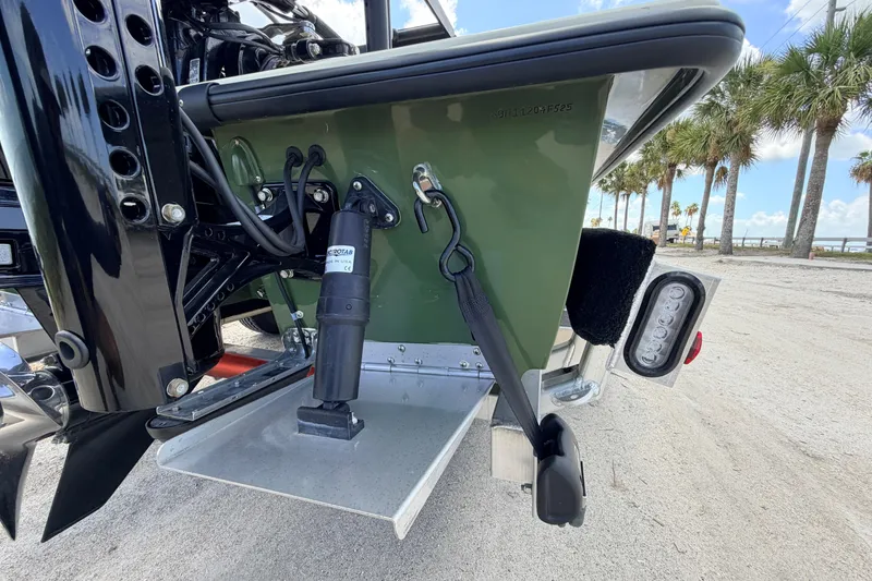 Slide: The Image of 2025 Hell's Bay Professional boat transom with motor mount and trim tab. - 22