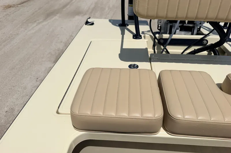 Slide: The Image of 2025 Hell's Bay Professional boat with beige cushioned seating and sleek design. - 56