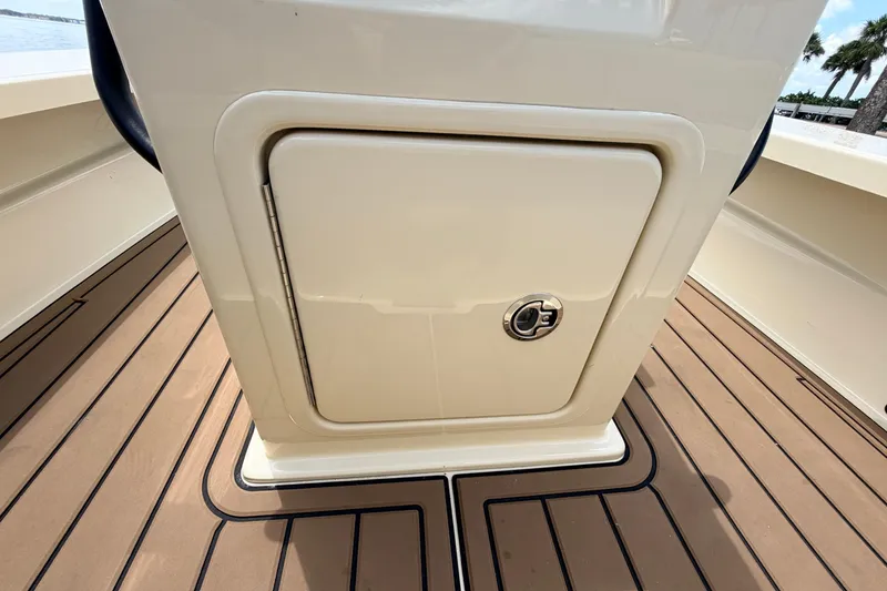 Slide: The Image of 2025 Hell's Bay Professional boat with sleek storage compartment on teak deck. - 50