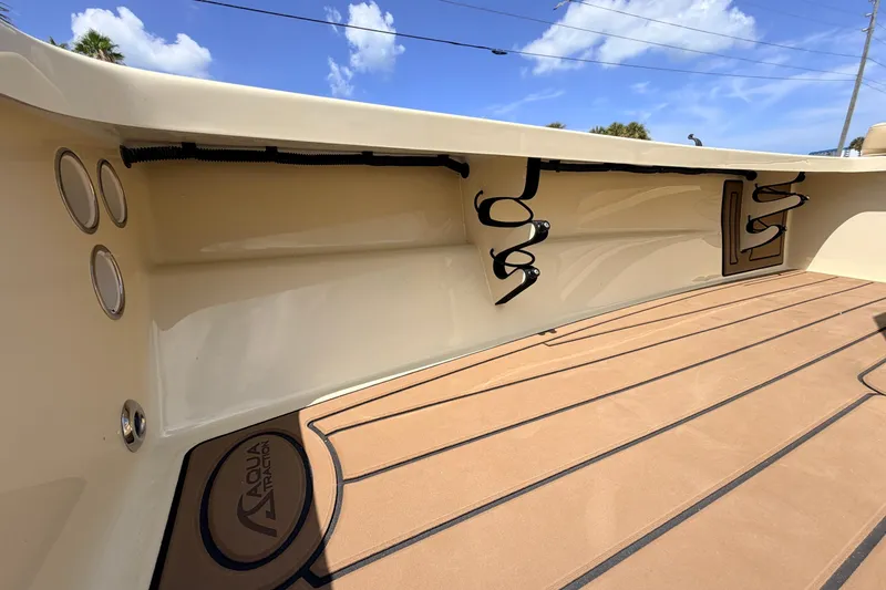 Slide: The Image of 2025 Hell's Bay Professional boat interior with AquaTraction flooring and rod holders. - 39