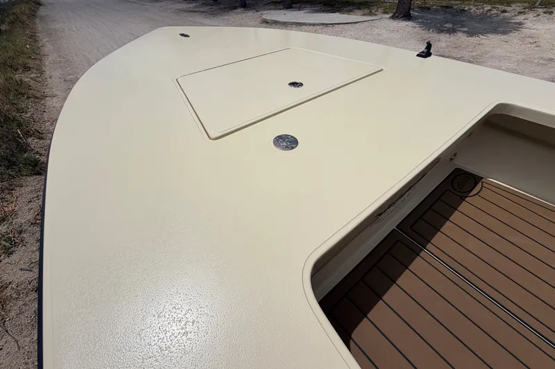 Slide: The Image of 2025 Hell's Bay Professional boat deck with storage hatch, showcasing sleek design and craftsmanship. - 32