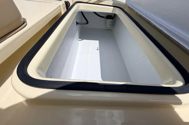 Slide: The Image of Open storage compartment on 2025 Hell's Bay Professional boat, showcasing interior design. - 64