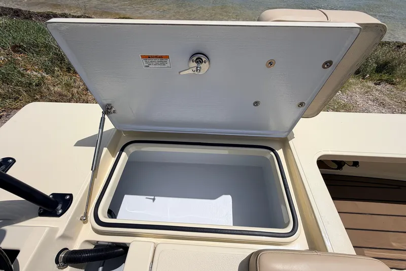 Slide: The Image of Open storage compartment on 2025 Hell's Bay Professional boat, showcasing interior space. - 63