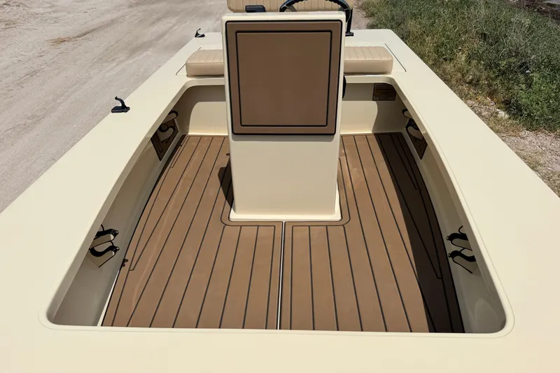 Slide: The Image of 2025 Hell's Bay Professional boat interior with tan deck and central console. - 38