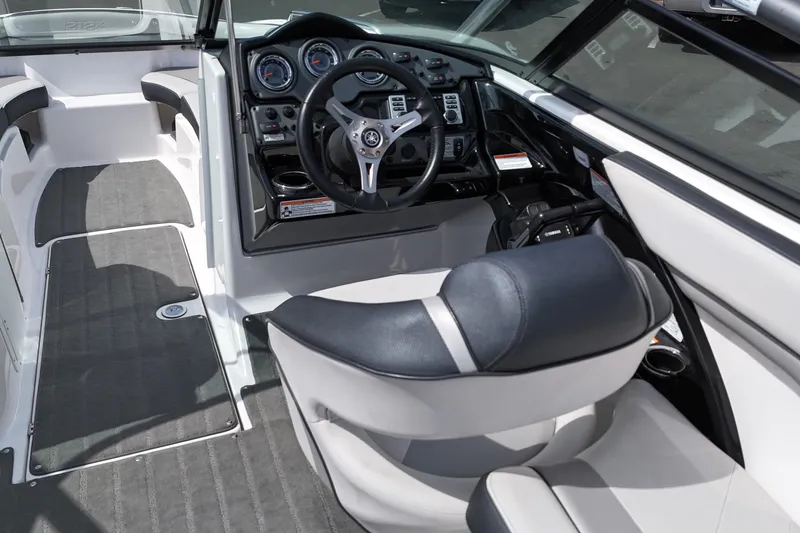 Slide: The Image of Interior view of a 2016 Yamaha Boats 212X, featuring sleek design and modern controls. - 8