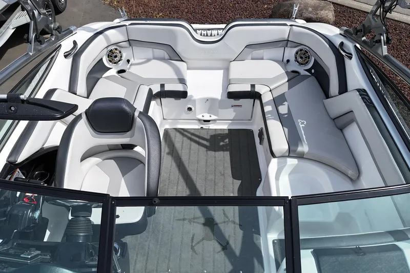 Slide: The Image of Interior view of a 2016 Yamaha Boats 212X, featuring sleek seating and modern design. - 6