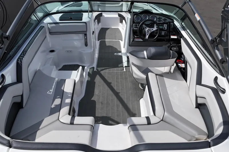 Slide: The Image of Interior of 2016 Yamaha Boats 212X, featuring spacious seating and modern dashboard design. - 9