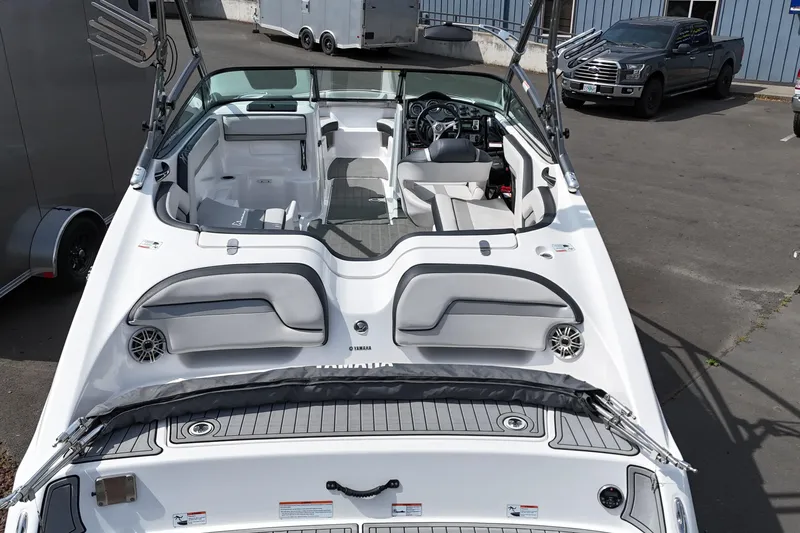 Slide: The Image of 2016 Yamaha Boats 212X interior view, showcasing seating and dashboard features. - 10