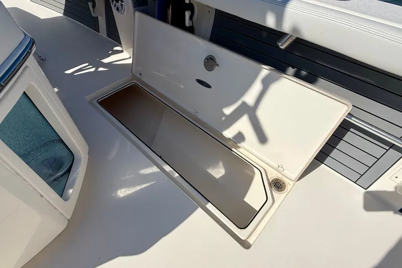 Slide: The Image of Open storage compartment on a 2022 Pathfinder 2700 Open boat. - 38