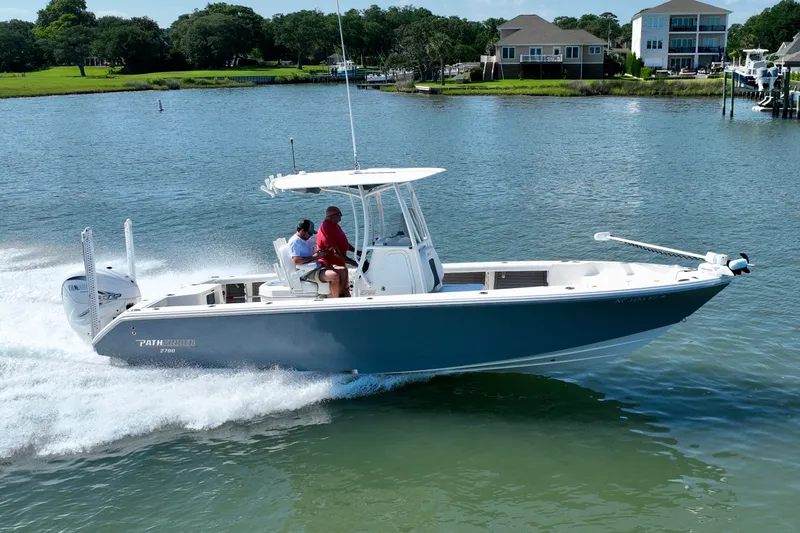 Slide: The Image of 2022 Pathfinder 2700 Open on calm water with two people on board. - 17