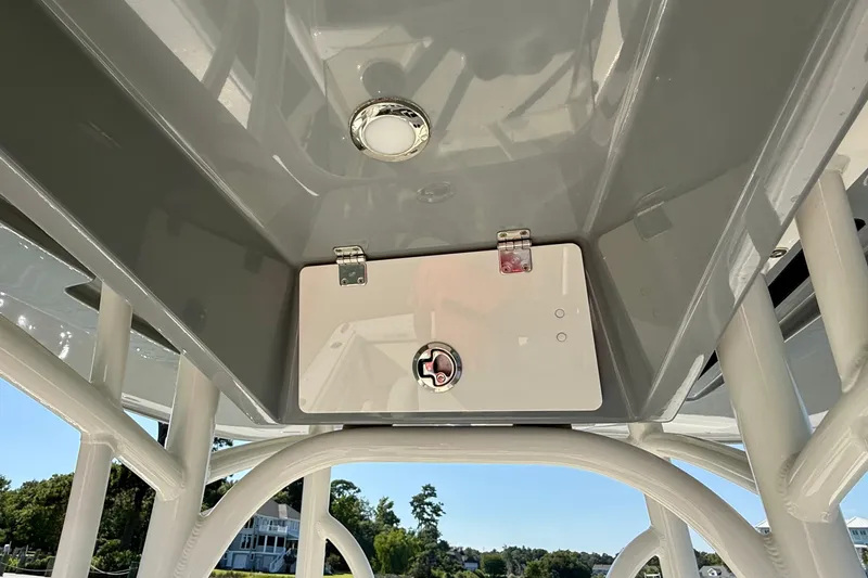 Slide: The Image of Interior view of a boat roof with a locked compartment and lighting. - 39