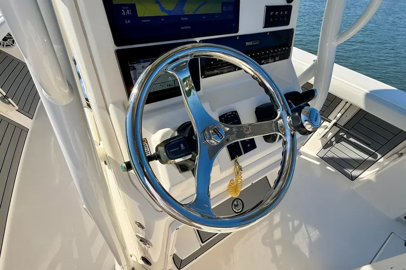 Slide: The Image of Helm of a 2022 Pathfinder 2700 Open with a shiny steering wheel and modern instruments. - 43