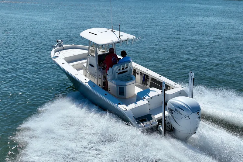 Slide: The Image of Pathfinder 2700 Open 2022 on the water with two people on board. - 13