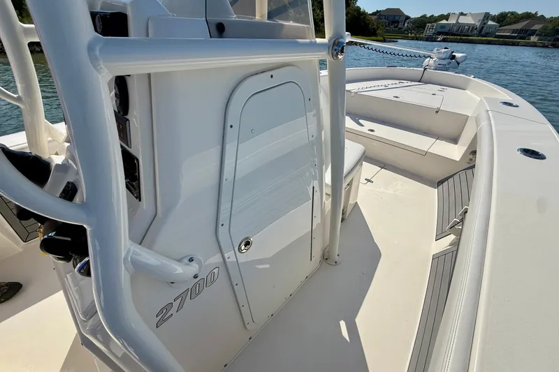 Slide: The Image of A white boat on calm water, featuring an open deck and modern details. - 29