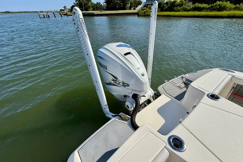 Slide: The Image of A 2022 Pathfinder 2700 Open boat with a Yamaha outboard motor on calm water. - 47