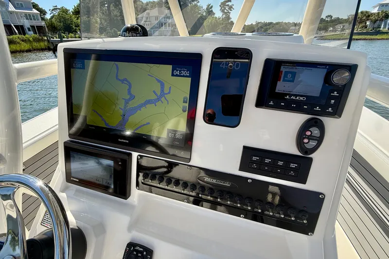 Slide: The Image of The image shows the helm of a 2022 Pathfinder 2700 Open with modern navigation equipment. - 41