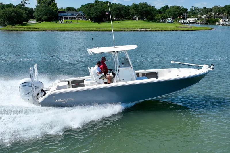 Slide: The Image of A 2022 Pathfinder 2700 Open boat speeding on calm water. - 16