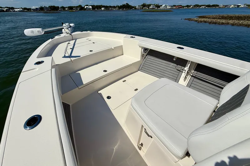 Slide: The Image of The image shows the bow of a 2022 Pathfinder 2700 Open boat on the water. - 21