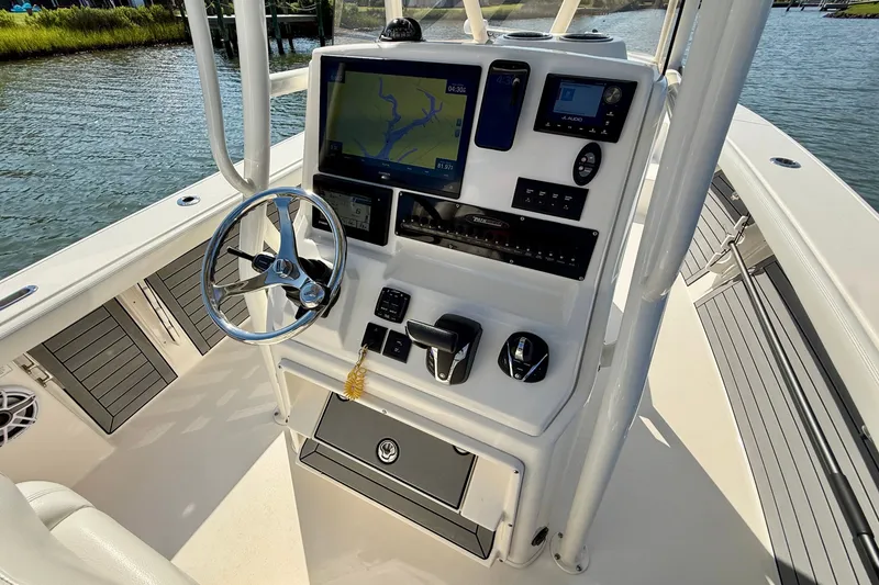 Slide: The Image of Pathfinder 2700 Open 2022: Helm with chartplotter and controls. - 40
