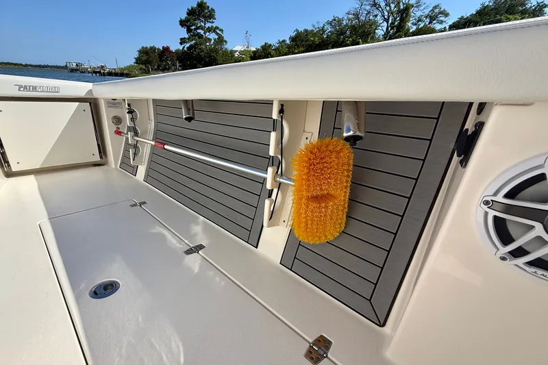 Slide: The Image of Pathfinder 2700 Open 2022: Side view with storage compartments and cleaning brush. - 33