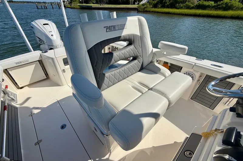 Slide: The Image of A modern boat with comfortable seating and a helm station on calm water. - 46